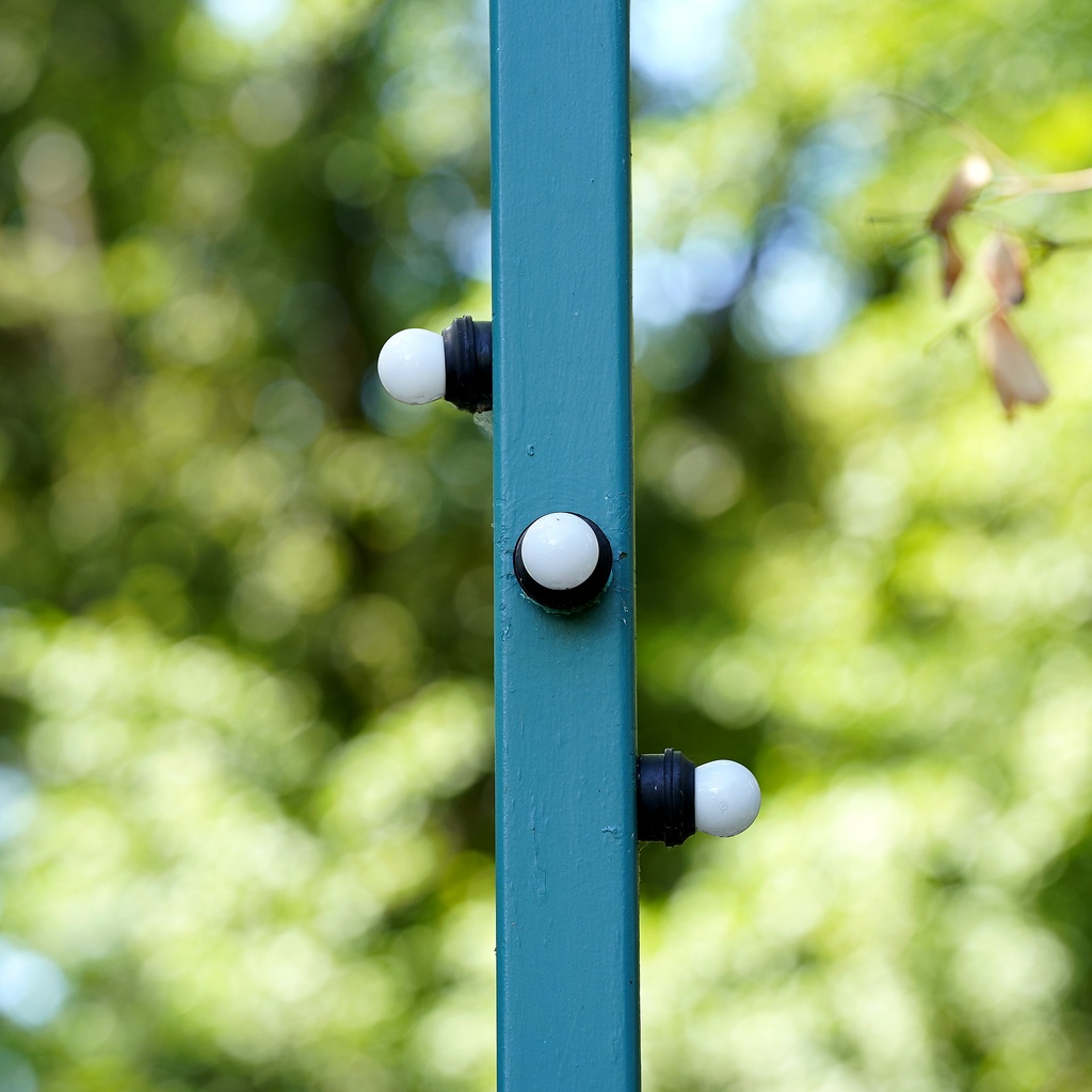 Mid-Century Minimal: Triad Luminaire on Teal Steel Beam